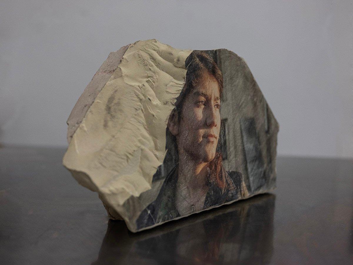 A monolithography work by Ali Arkady — a photographic image transferred onto a limestone stone.