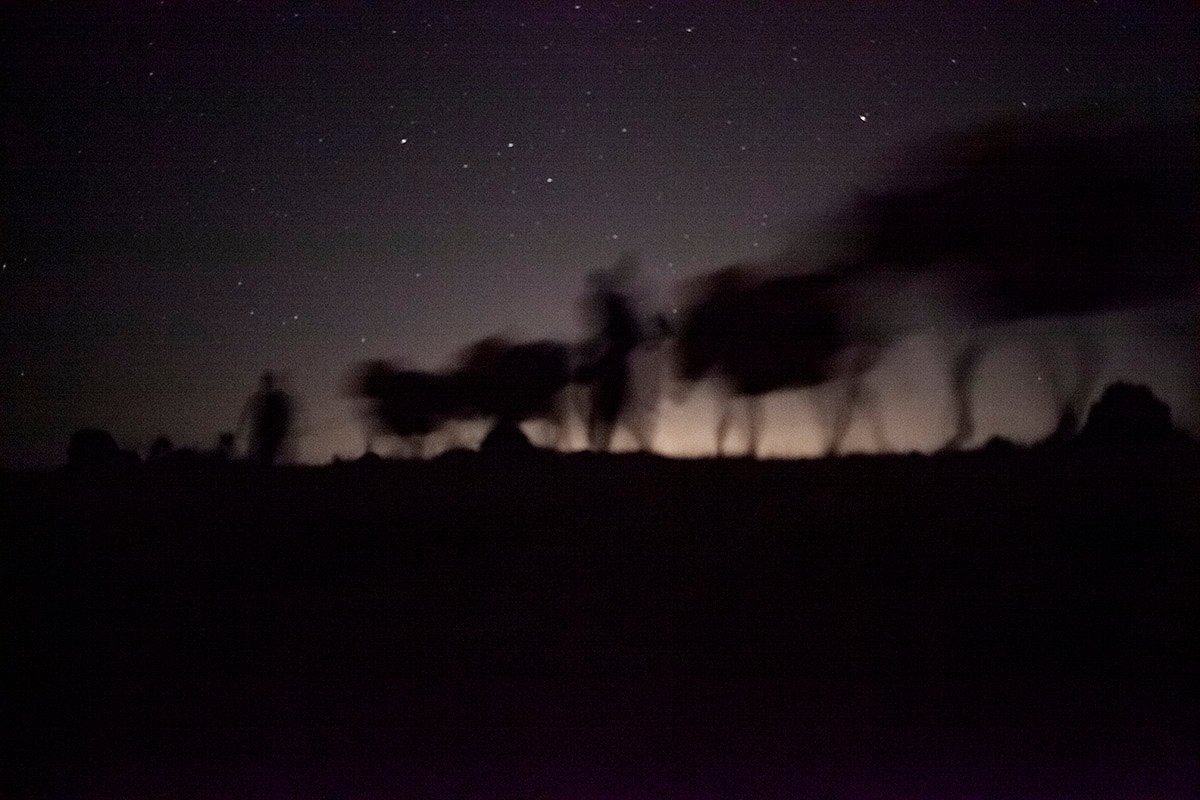 A donkey loaded with cargo on a mountain path at night, Hawraman, Kurdistan Region, Iraq.