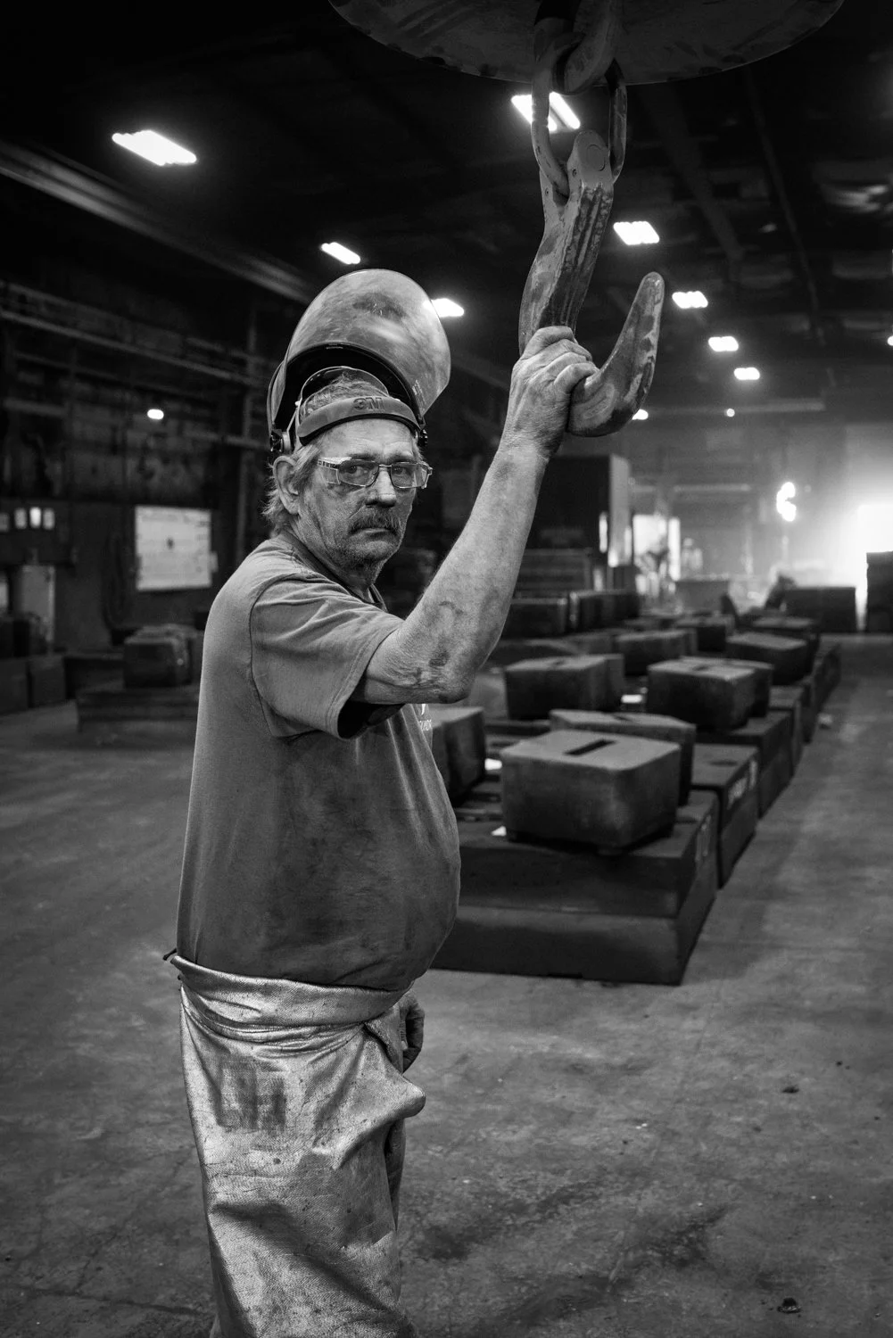 Foundry worker pouring metal, South Dakota