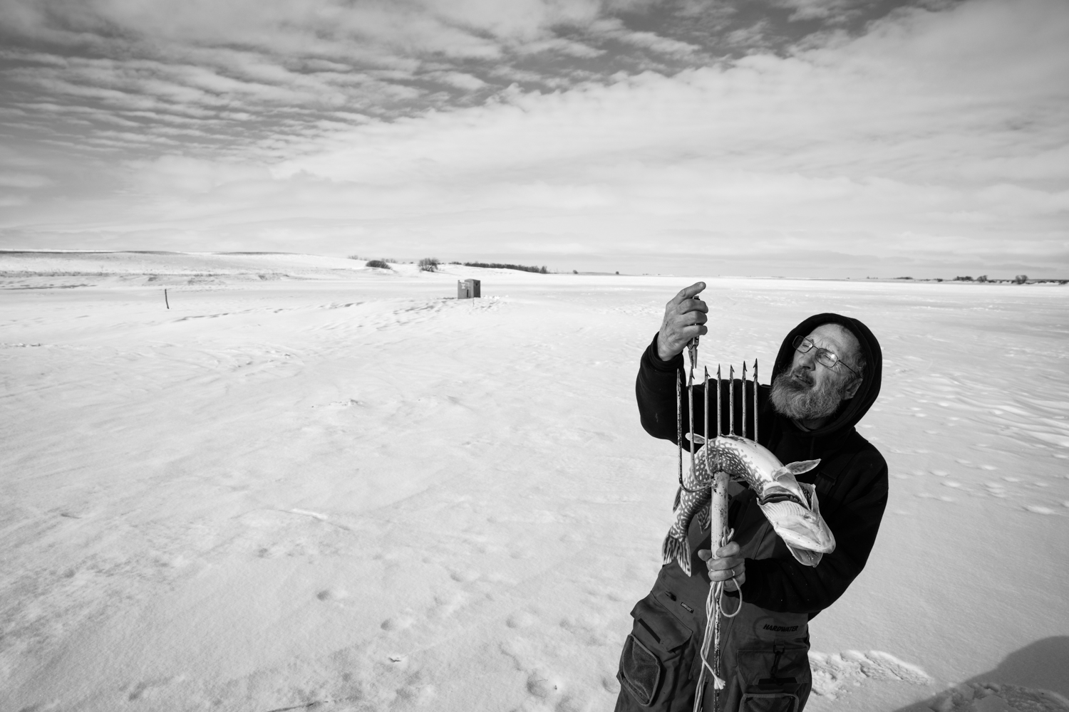 Ice fisherman on a frozen North Dakota lake