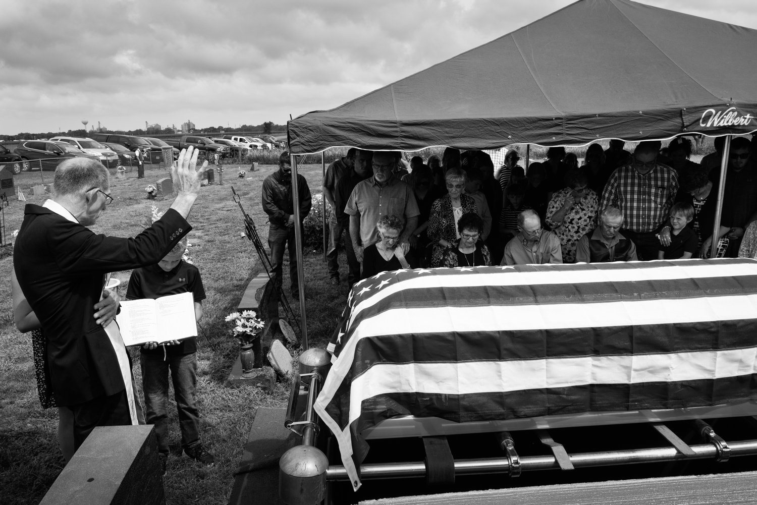 Veteran funeral, flag-draped casket, graveside service