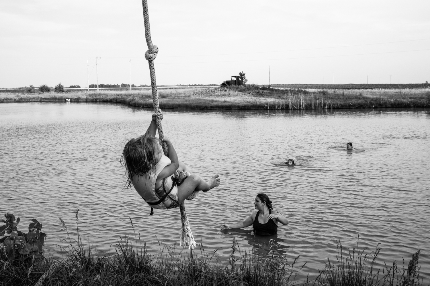 A rope descending into still water, Macksville, Kansas